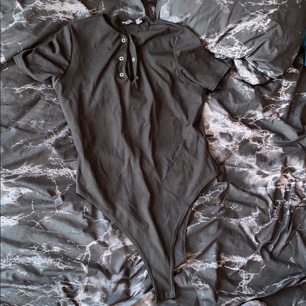 black ribbed bodysuit with silver buttons